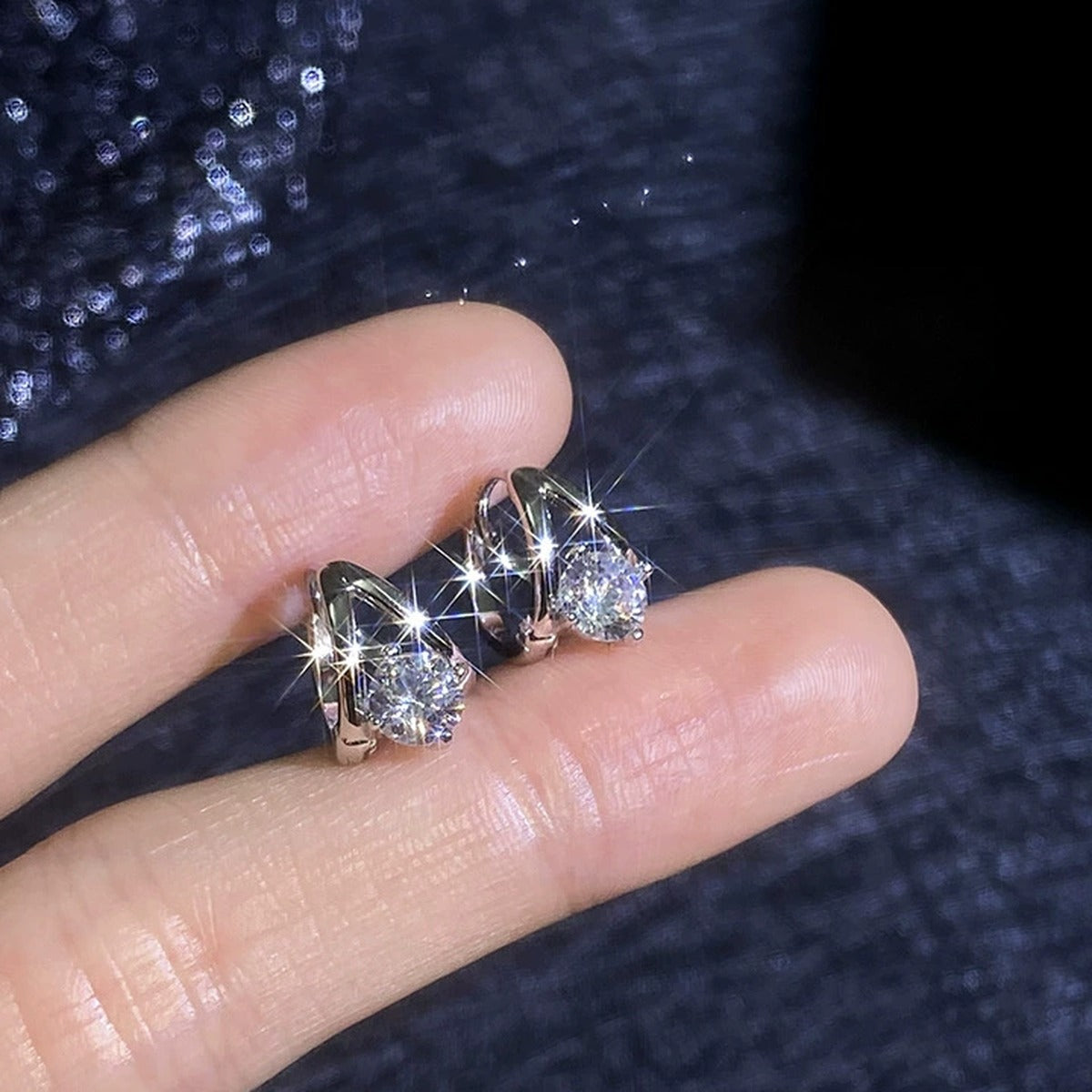 Round Moissanite Huggie Hoop Earrings in White Gold-Plated S925 Sterling Silver close-up product detail view