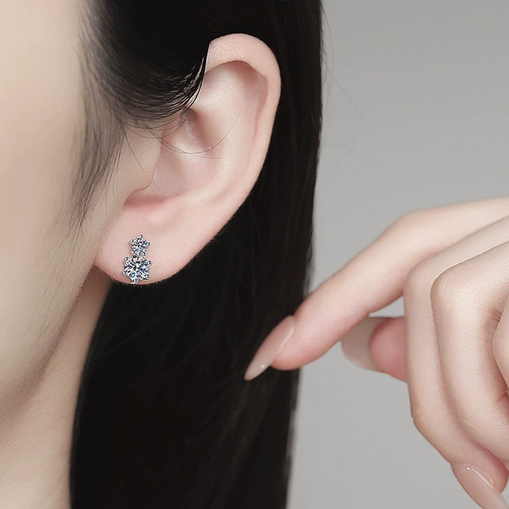 Two-Stone Moissanite Stud Earrings in White Gold-Plated S925 Sterling Silver worn on ear by model