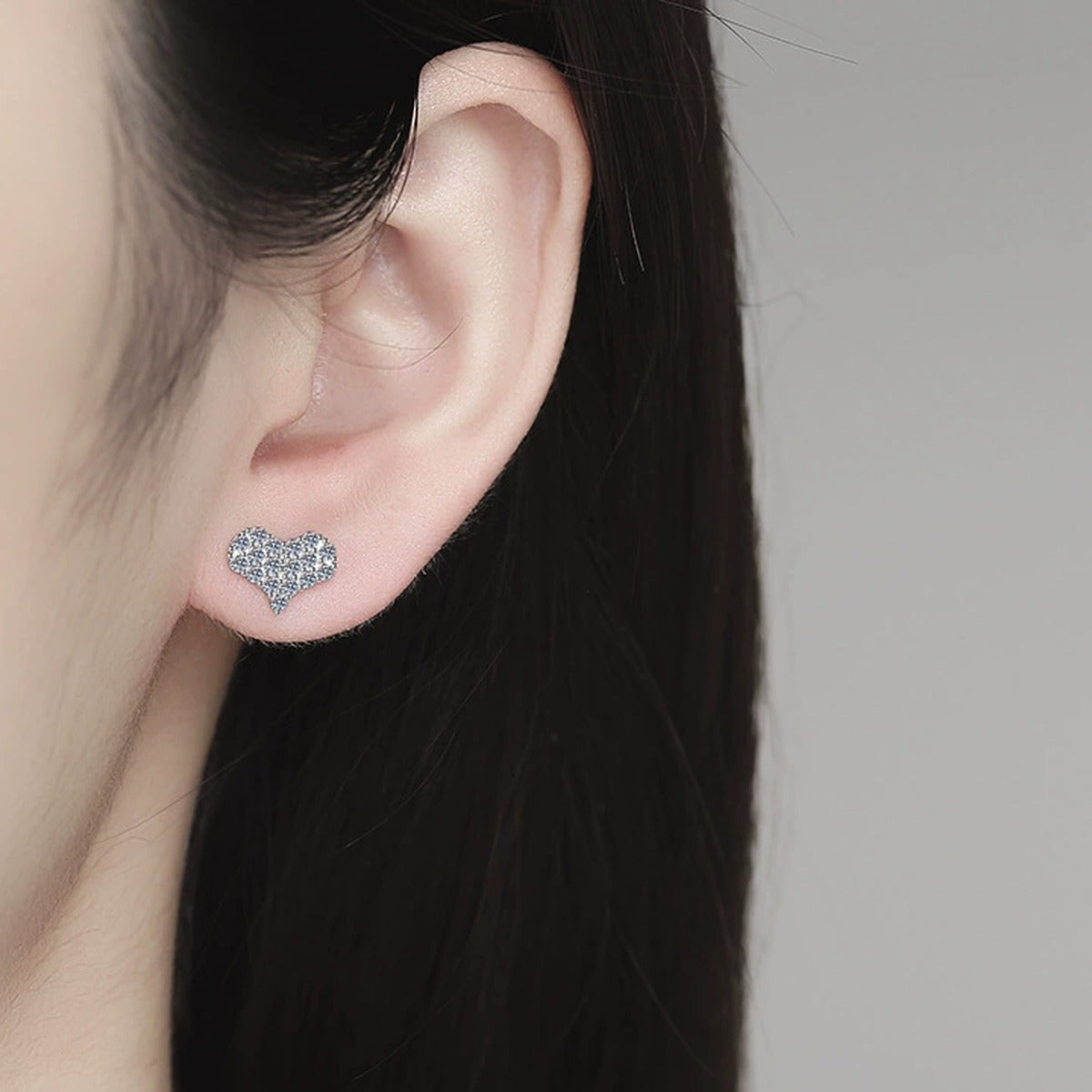 Heart Moissanite Stud Earrings in Gold-Plated S925 Sterling Silver worn on ear by model