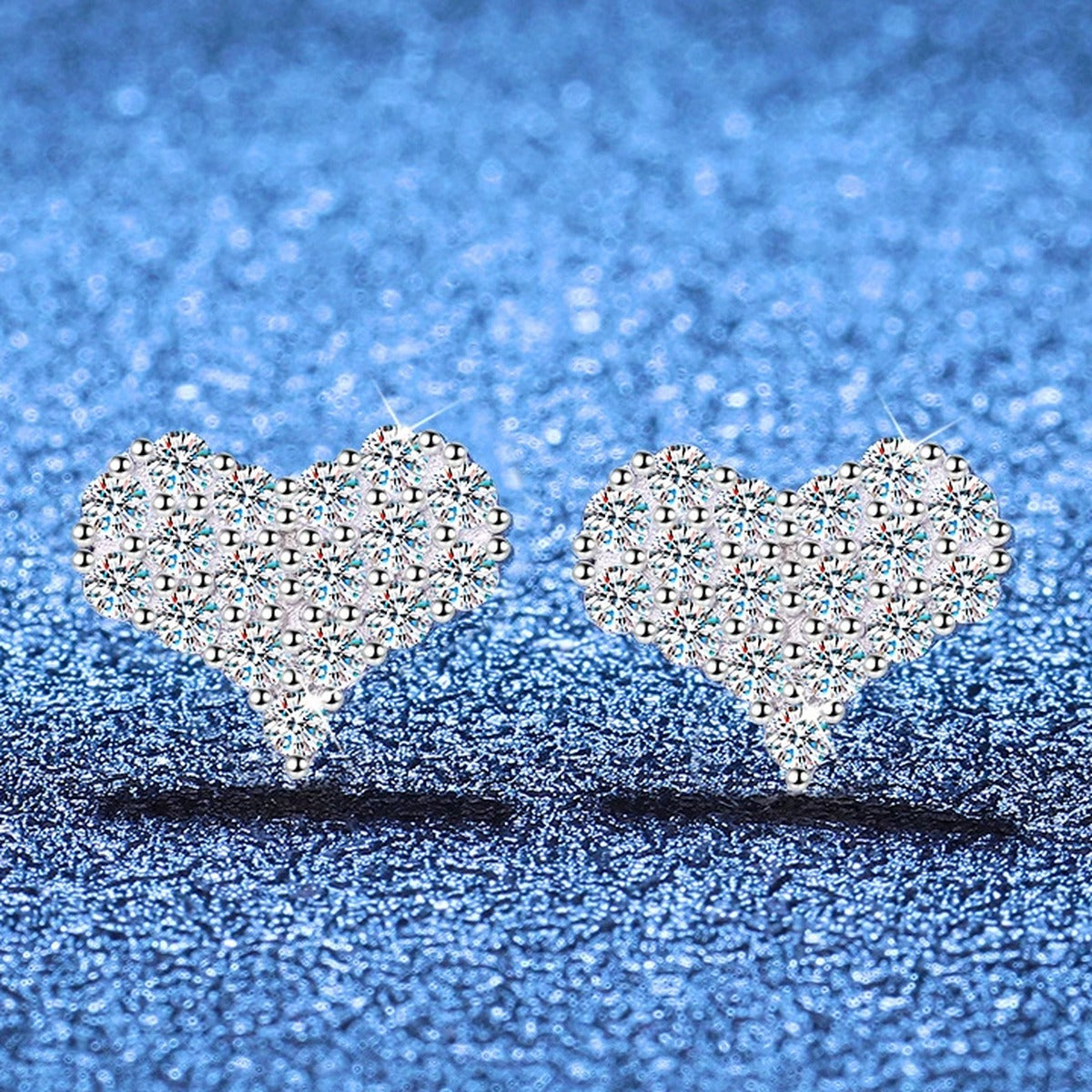 Heart Moissanite Stud Earrings in Gold-Plated S925 Sterling Silver blue scene angled view