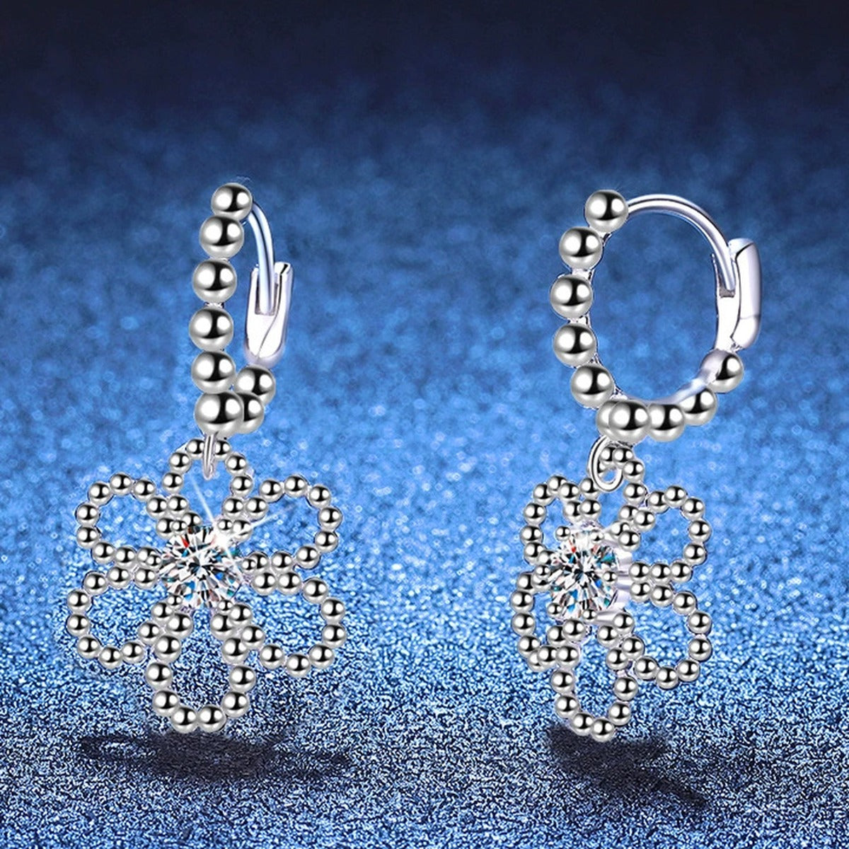 Floral Moissanite Hoop Drop Earrings in White Gold-Plated S925 Sterling Silver blue scene angled view