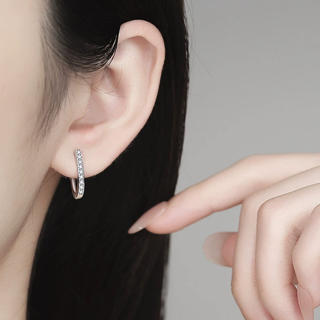 Pave Moissanite Hoop Earrings in White Gold-Plated S925 Sterling Silver worn on ear by model