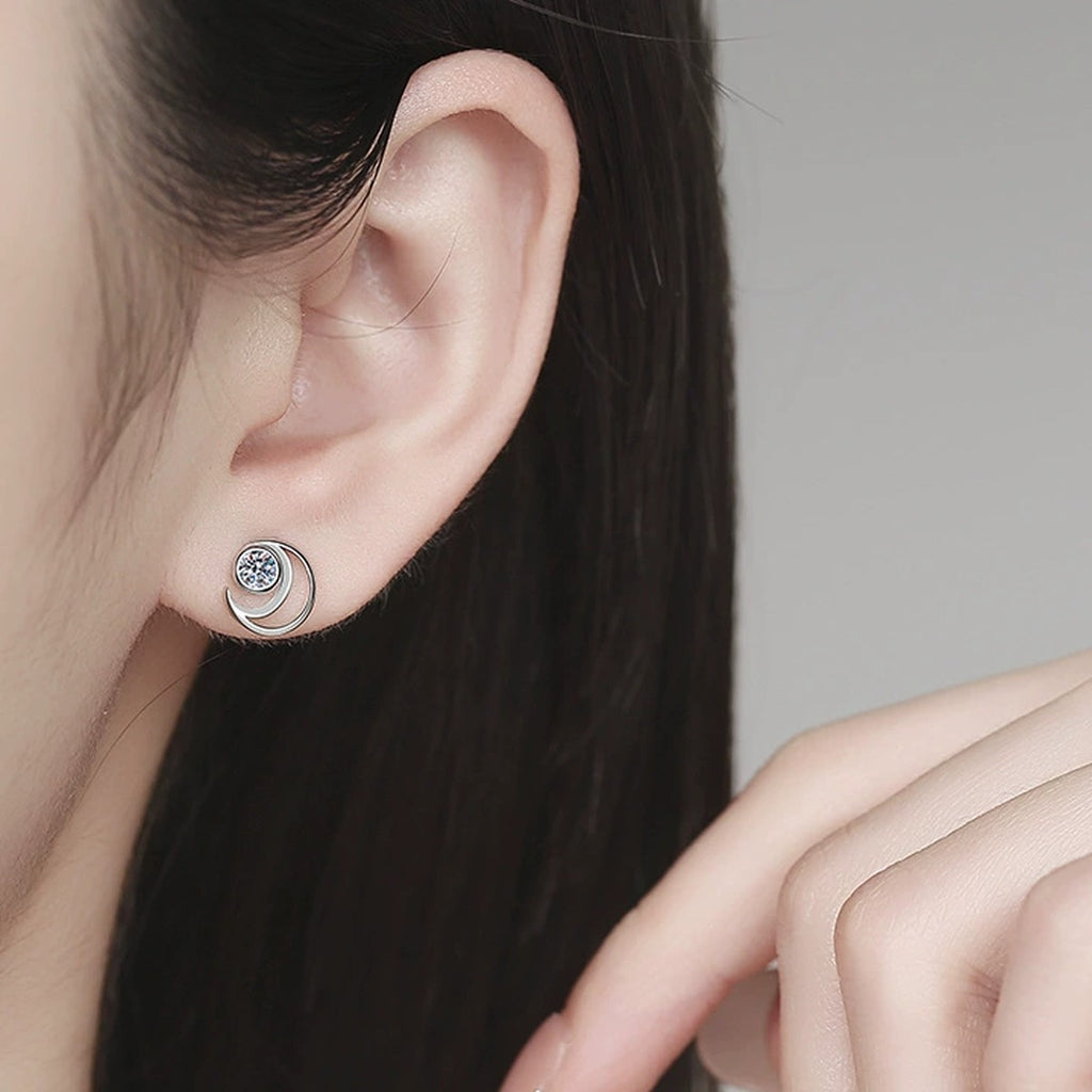 Moon Moissanite Stud Earrings in White Gold-Plated S925 Sterling Silver worn on ear by model