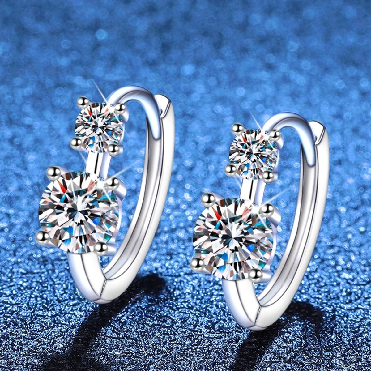 Two-Stone Moissanite Hoop Earrings in White Gold-Plated S925 Sterling Silver blue scene angled view