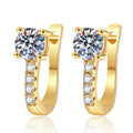 Round Moissanite Huggie Hoop Earrings with CZ in Yellow Gold-Plated S925 Sterling Silver on clean white background showing a yellow gold huggie hoop with a round moissanite top and CZ trail