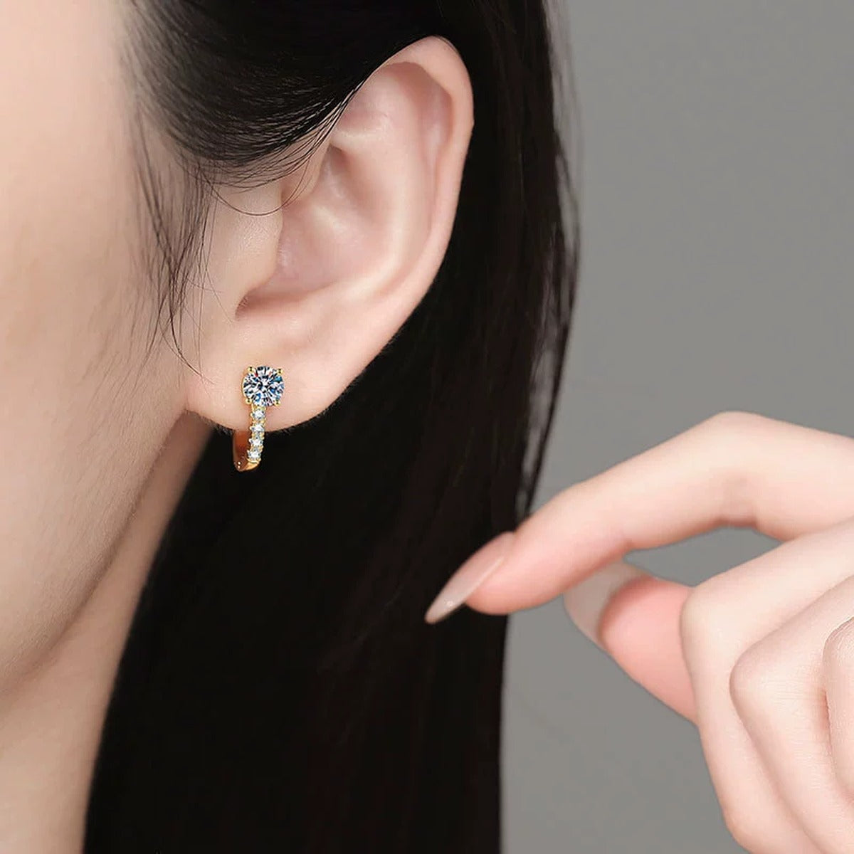 Round Moissanite Huggie Hoop Earrings with CZ in Yellow Gold-Plated S925 Sterling Silver worn on ear by model