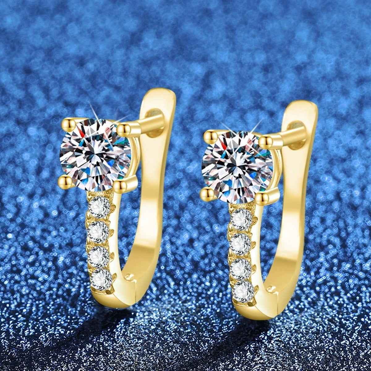 Round Moissanite Huggie Hoop Earrings with CZ in Yellow Gold-Plated S925 Sterling Silver blue scene angled view