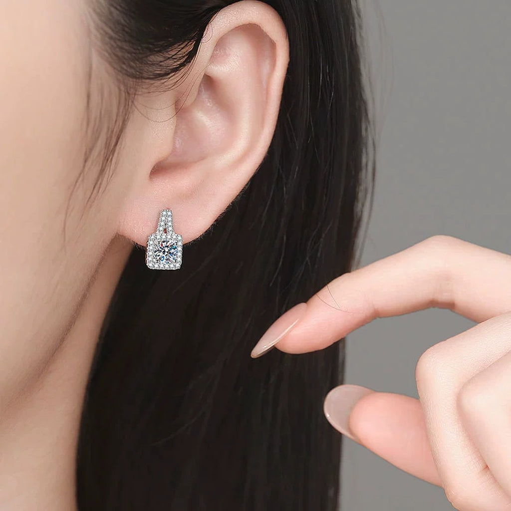 Tapered Halo Moissanite Stud Earrings with CZ in White Gold-Plated S925 Sterling Silver worn on ear by model