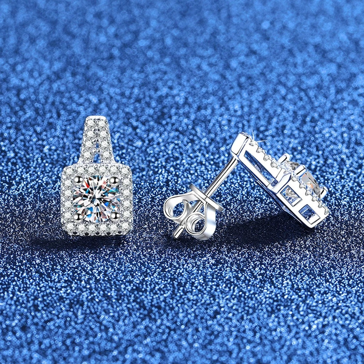 Tapered Halo Moissanite Stud Earrings with CZ in White Gold-Plated S925 Sterling Silver blue scene angled view