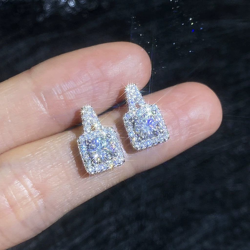 Tapered Halo Moissanite Stud Earrings with CZ in White Gold-Plated S925 Sterling Silver close-up product detail view