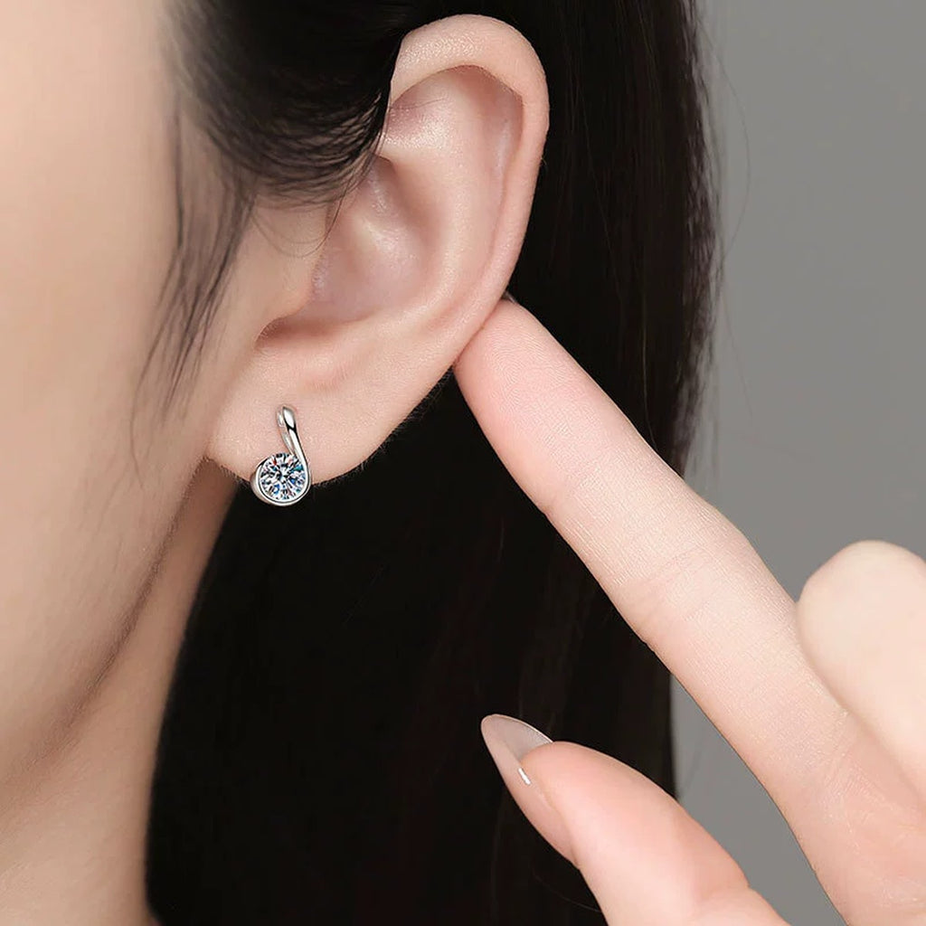 Curved Teardrop Moissanite Stud Earrings in White Gold-Plated S925 Sterling Silver worn on ear by model