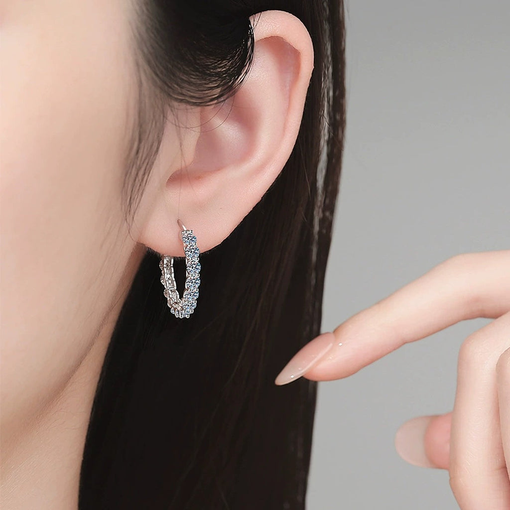 Large Pave Moissanite Hoop Earrings in White Gold-Plated S925 Sterling Silver worn on ear by model