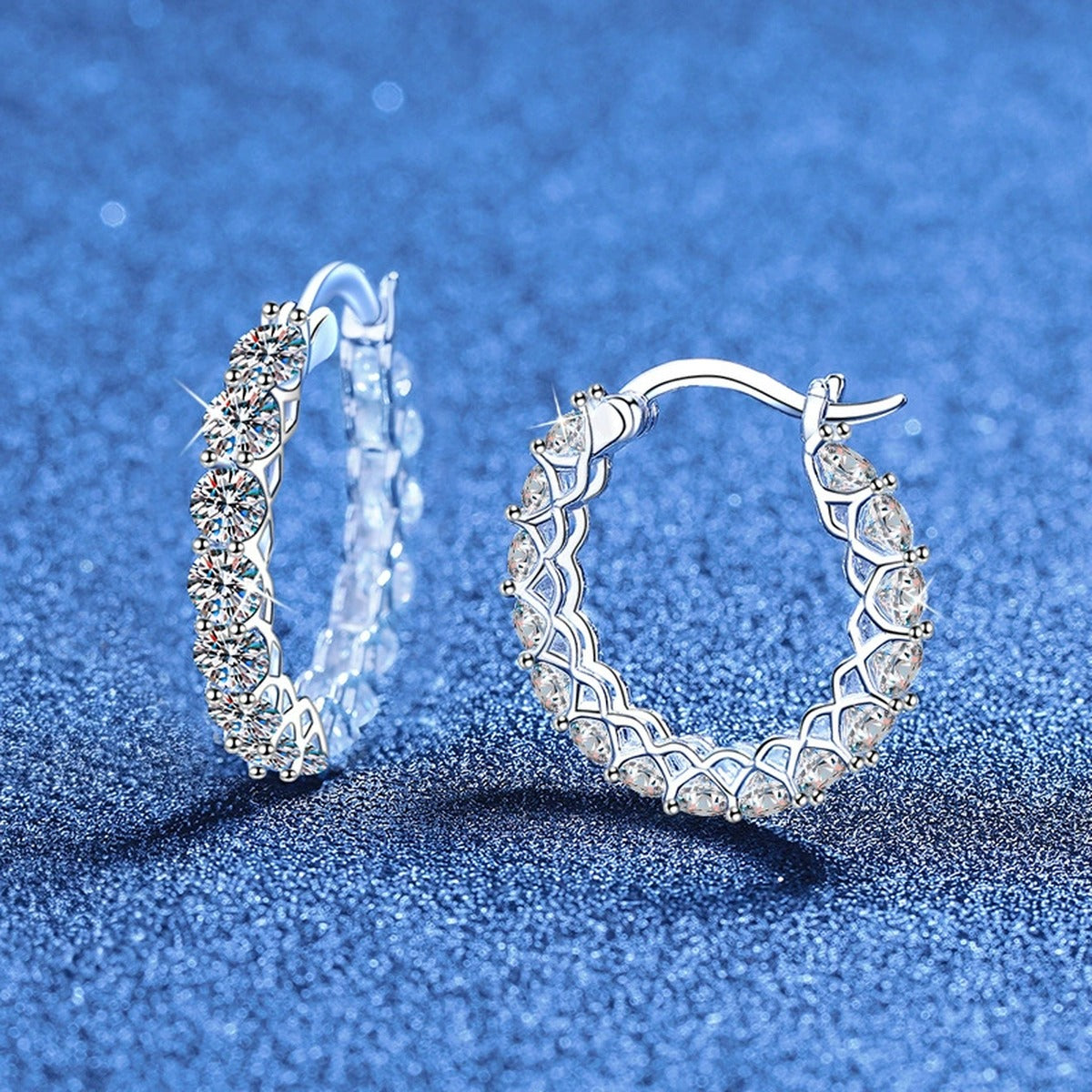 Large Pave Moissanite Hoop Earrings in White Gold-Plated S925 Sterling Silver blue scene angled view