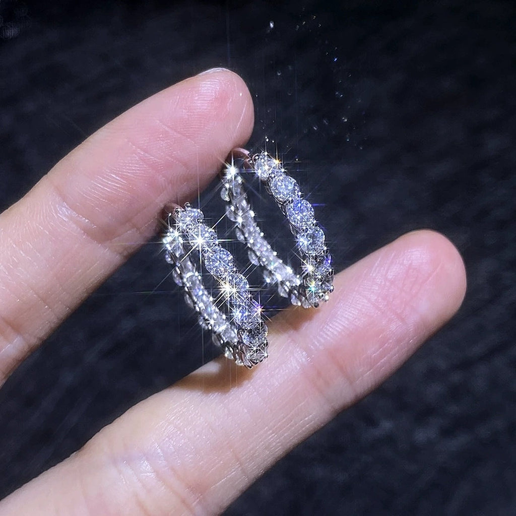 Large Pave Moissanite Hoop Earrings in White Gold-Plated S925 Sterling Silver dark background product display view