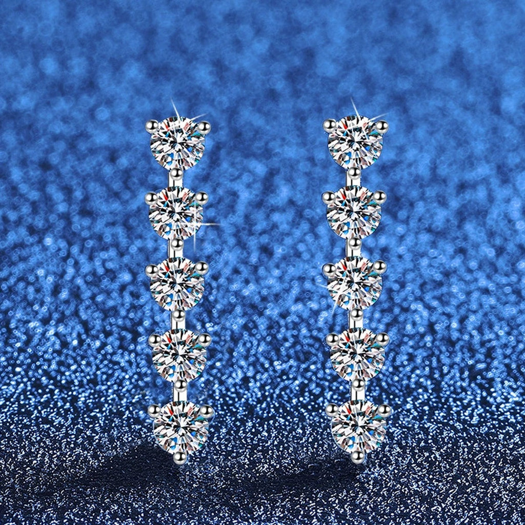 Five-Stone Moissanite Drop Earrings in White Gold-Plated S925 Sterling Silver blue scene angled view