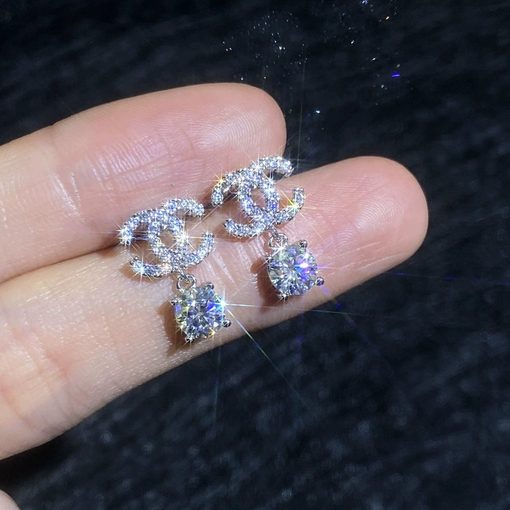 Ribbon Drop Moissanite Stud Earrings with CZ in White Gold-Plated S925 Sterling Silver close-up product detail view