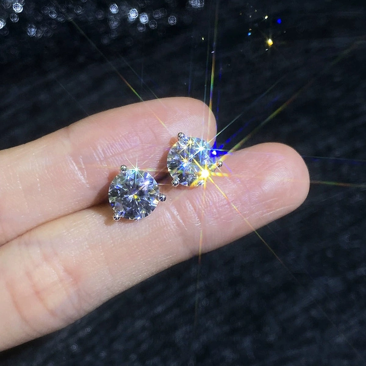 Round Moissanite Stud Earrings in White Gold-Plated S925 Sterling Silver worn on ear by model