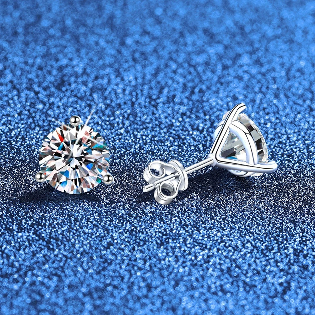 Round Moissanite Stud Earrings in White Gold-Plated S925 Sterling Silver blue scene close-up view