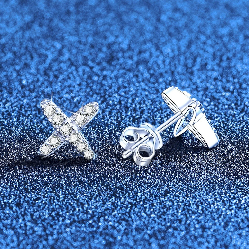 Cross Moissanite Stud Earrings in White Gold-Plated S925 Sterling Silver blue scene angled view