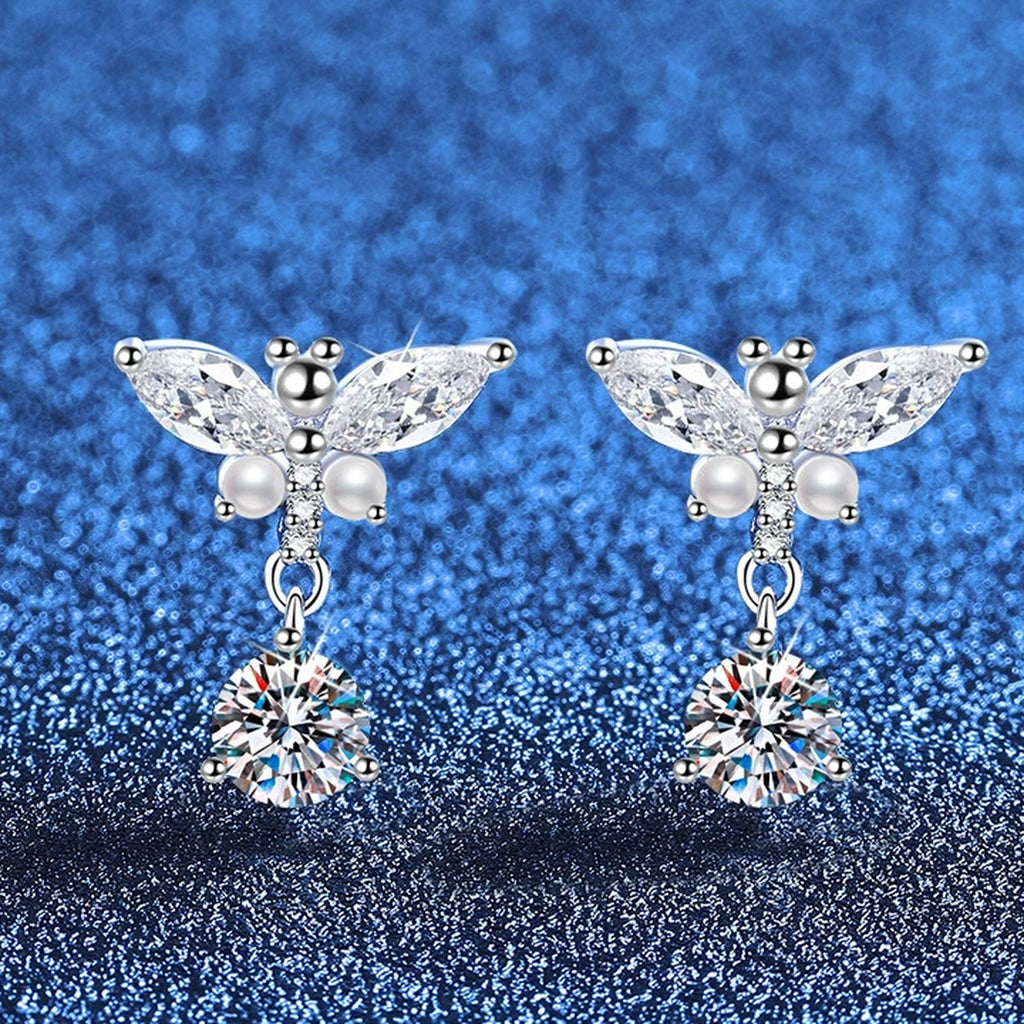 Bow Drop Moissanite Earrings with CZ in White Gold-Plated S925 Sterling Silver blue scene angled view