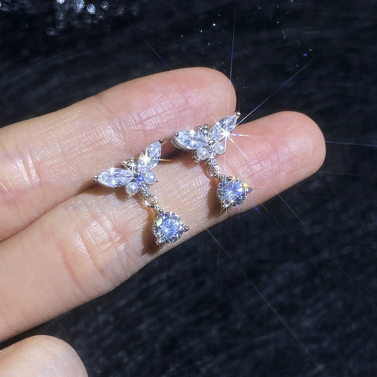 Bow Drop Moissanite Earrings with CZ in White Gold-Plated S925 Sterling Silver close-up product detail view