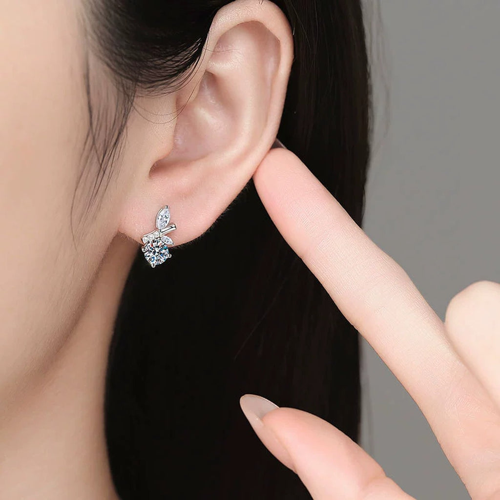 Leaf Accent Moissanite Stud Earrings with CZ in White Gold-Plated S925 Sterling Silver worn on ear by model