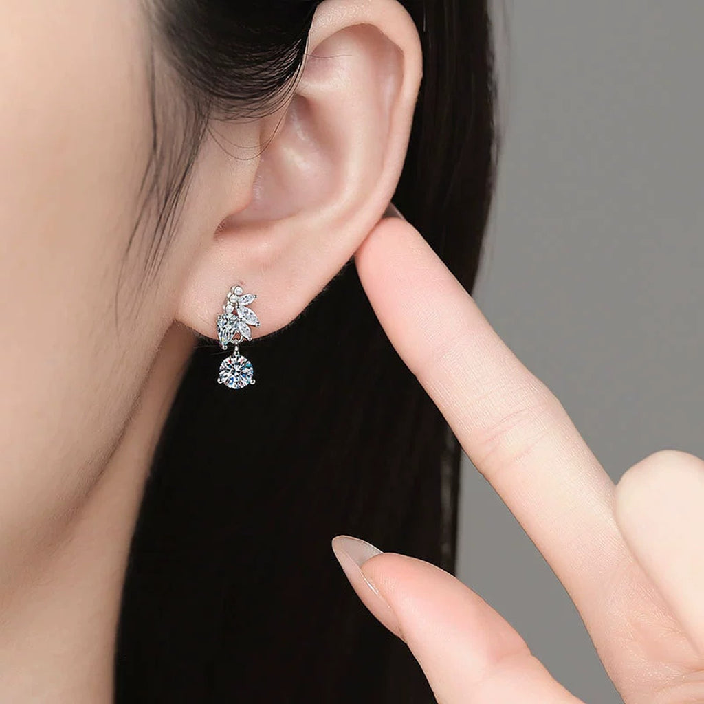 Leaf Drop Moissanite Earrings with CZ in White Gold-Plated S925 Sterling Silver worn on ear by model