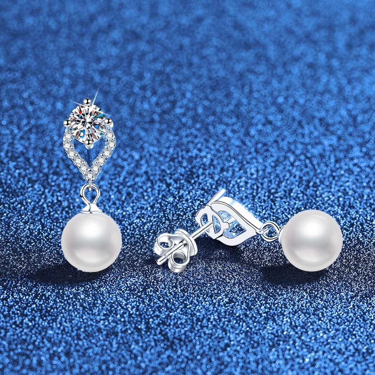 Pearl Teardrop Moissanite Earrings with CZ in White Gold-Plated S925 Sterling Silver blue scene angled view