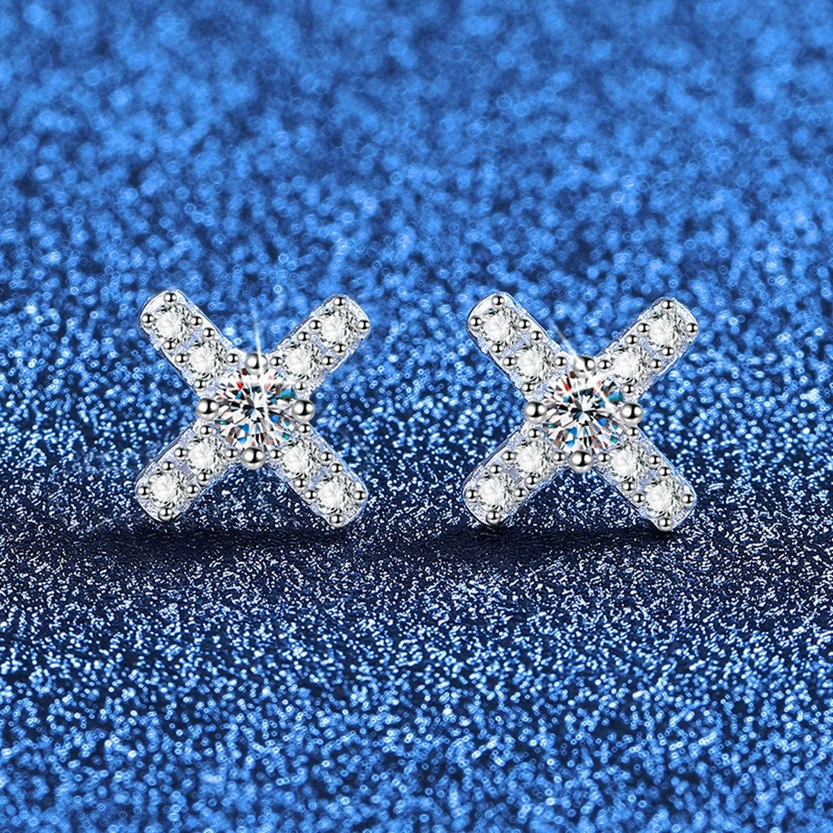 Cross Moissanite Stud Earrings with CZ in White Gold-Plated S925 Sterling Silver blue scene angled view
