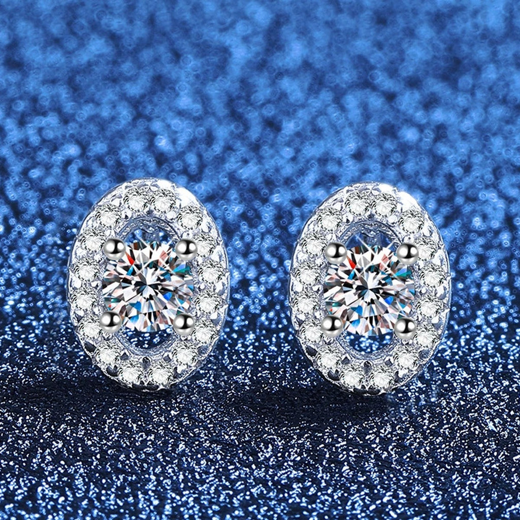 Oval Halo Moissanite Stud Earrings with CZ in White Gold-Plated S925 Sterling Silver blue scene angled view