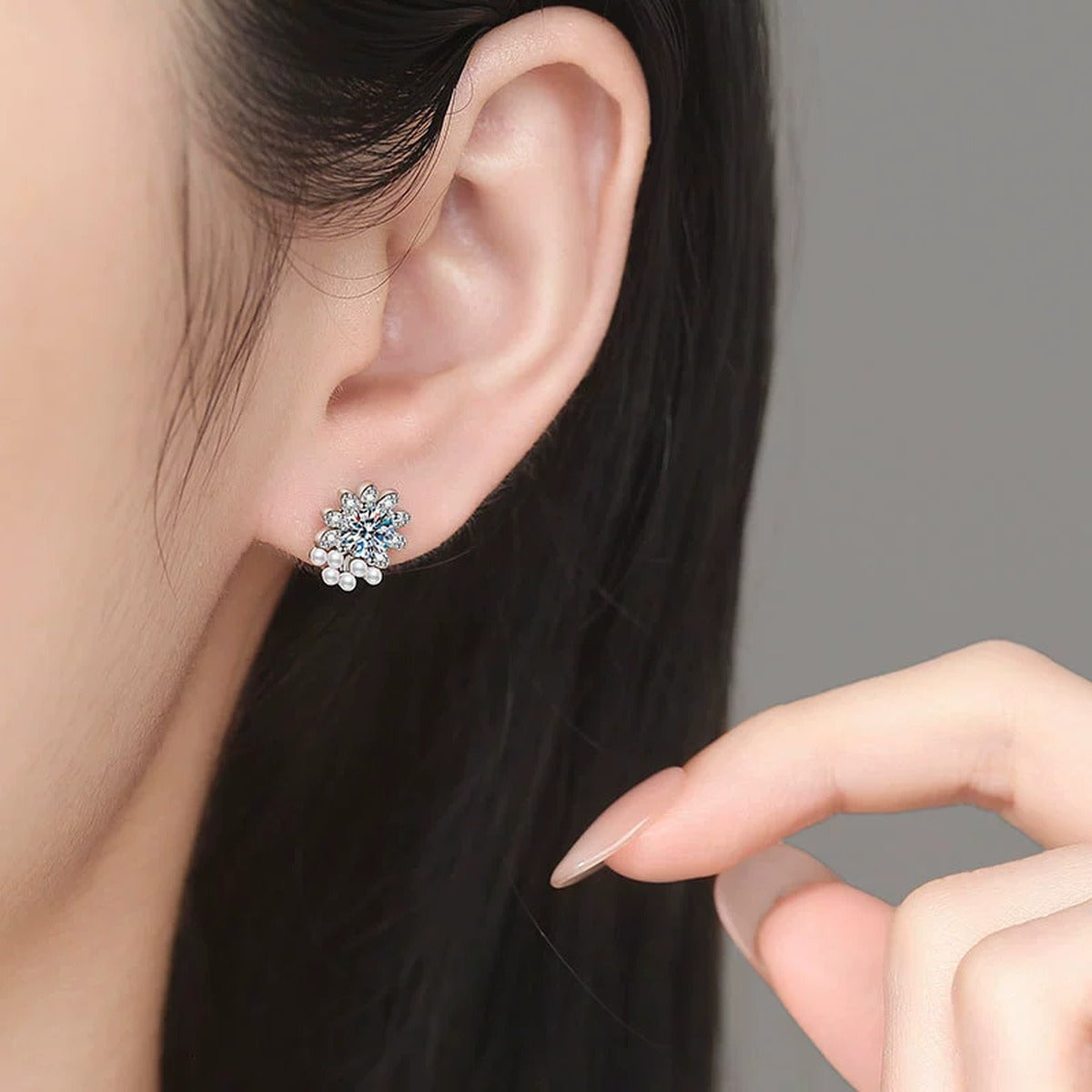 Pearl Floral Moissanite Stud Earrings with CZ in White Gold-Plated S925 Sterling Silver worn on ear by model