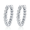 Beaded Moissanite Hoop Earrings in White Gold-Plated S925 Sterling Silver on clean white background showing a beaded hoop profile traced with small round moissanite stones