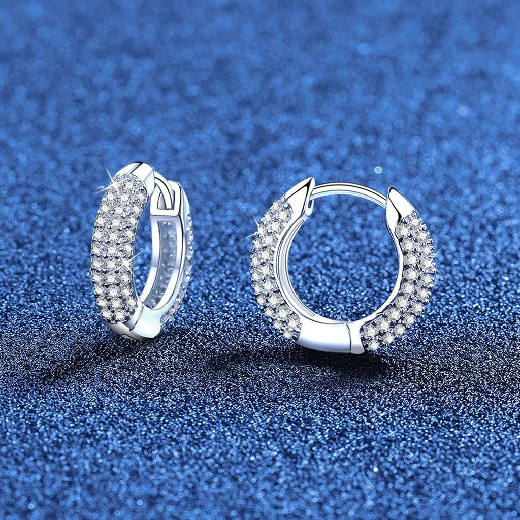 Pave Moissanite Huggie Hoop Earrings in White Gold-Plated S925 Sterling Silver blue scene angled view