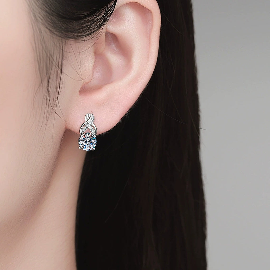 Round Moissanite Huggie Hoop Earrings with CZ in White Gold-Plated S925 Sterling Silver worn on ear by model