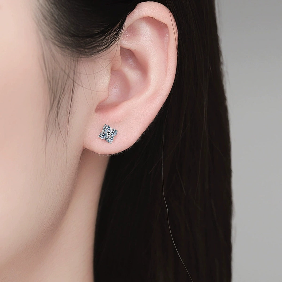 Cushion Moissanite Stud Earrings in Gold-Plated S925 Sterling Silver worn on ear by model