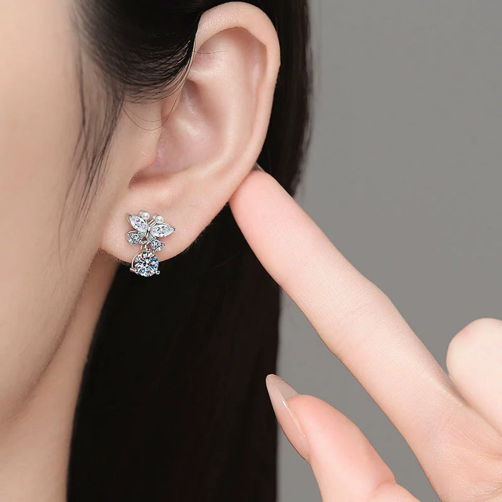 Butterfly Moissanite Stud Drop Earrings with CZ in White Gold-Plated S925 Sterling Silver worn on ear by model