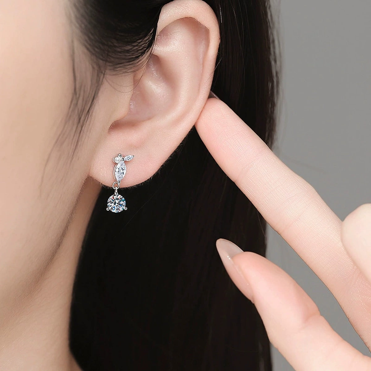 Leaf Moissanite Drop Earrings with CZ in White Gold-Plated S925 Sterling Silver worn on ear by model