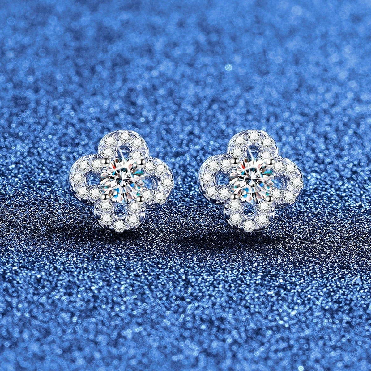 Clover Moissanite Stud Earrings with CZ in White Gold-Plated S925 Sterling Silver blue scene angled view
