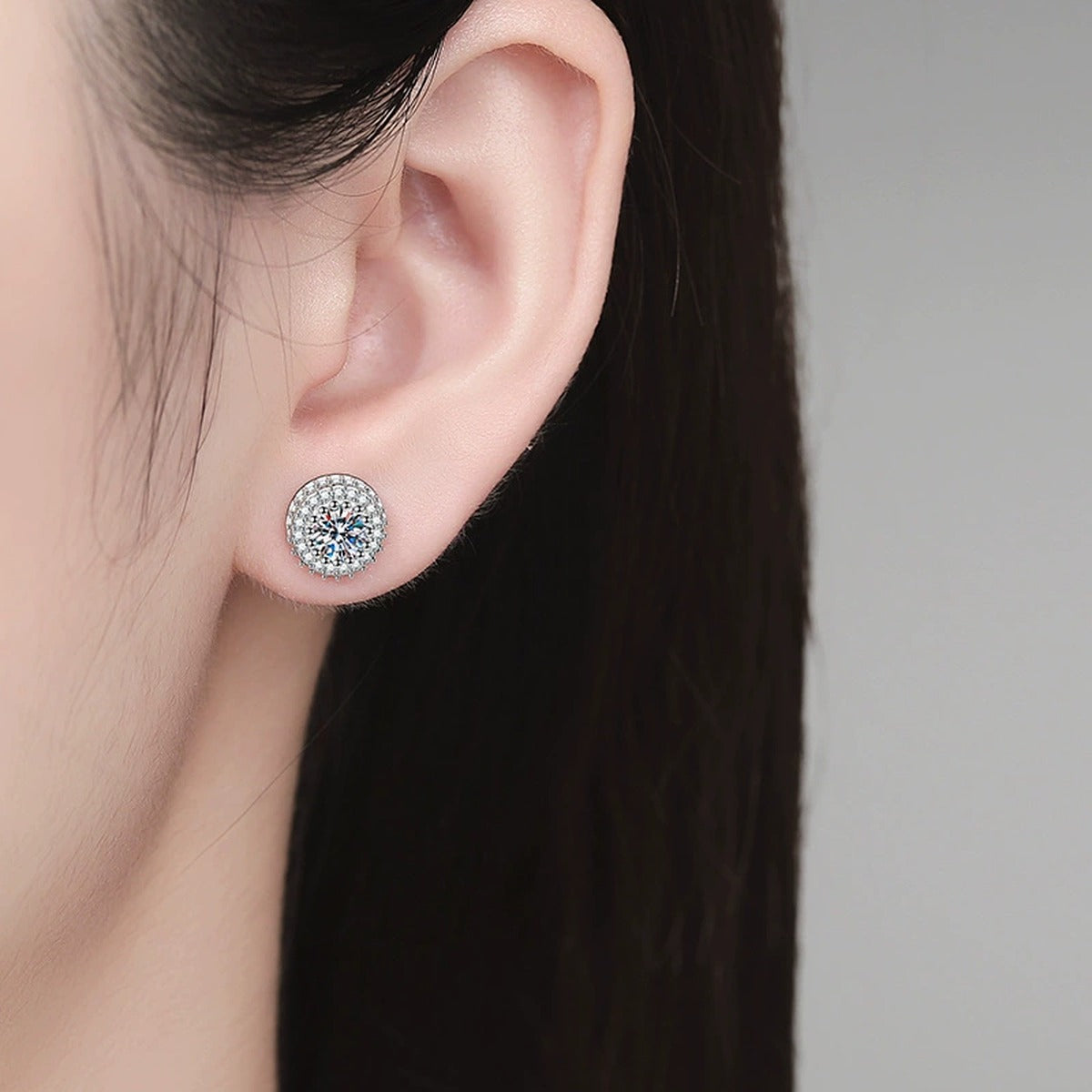 Round Halo Moissanite Stud Earrings with CZ in White Gold-Plated S925 Sterling Silver worn on ear by model