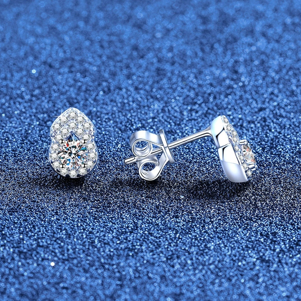 Pear Moissanite Stud Earrings with CZ in White Gold-Plated S925 Sterling Silver blue scene angled view