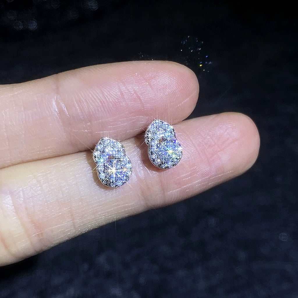 Pear Moissanite Stud Earrings with CZ in White Gold-Plated S925 Sterling Silver dark background product display view