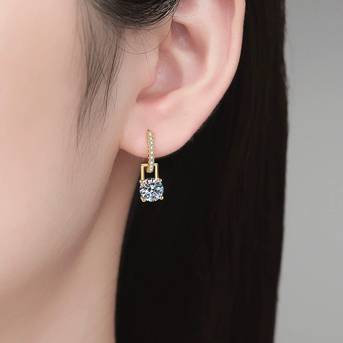Round Moissanite Huggie Hoop Earrings with CZ in Yellow Gold-Plated S925 Sterling Silver worn on ear by model