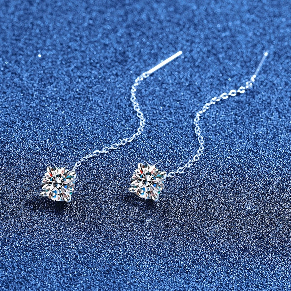 Round Moissanite Threader Drop Earrings in White Gold-Plated S925 Sterling Silver blue scene angled view