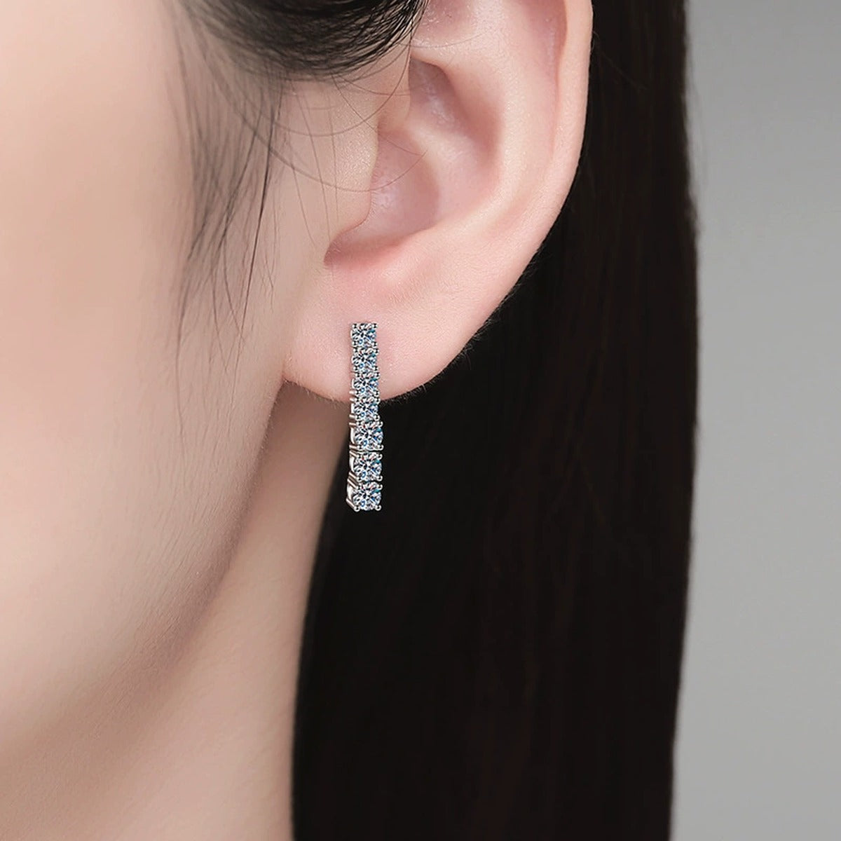 Bar Moissanite Drop Earrings in White Gold-Plated S925 Sterling Silver worn on ear by model
