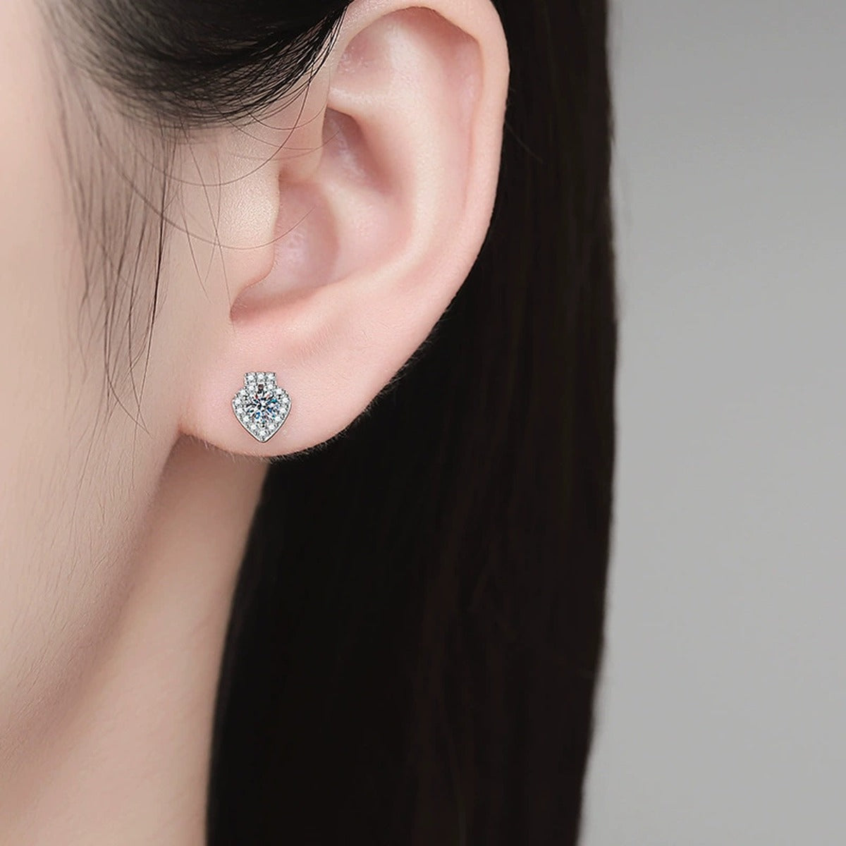 Teardrop Halo Moissanite Stud Earrings in White Gold-Plated S925 Sterling Silver with CZ worn on ear by model