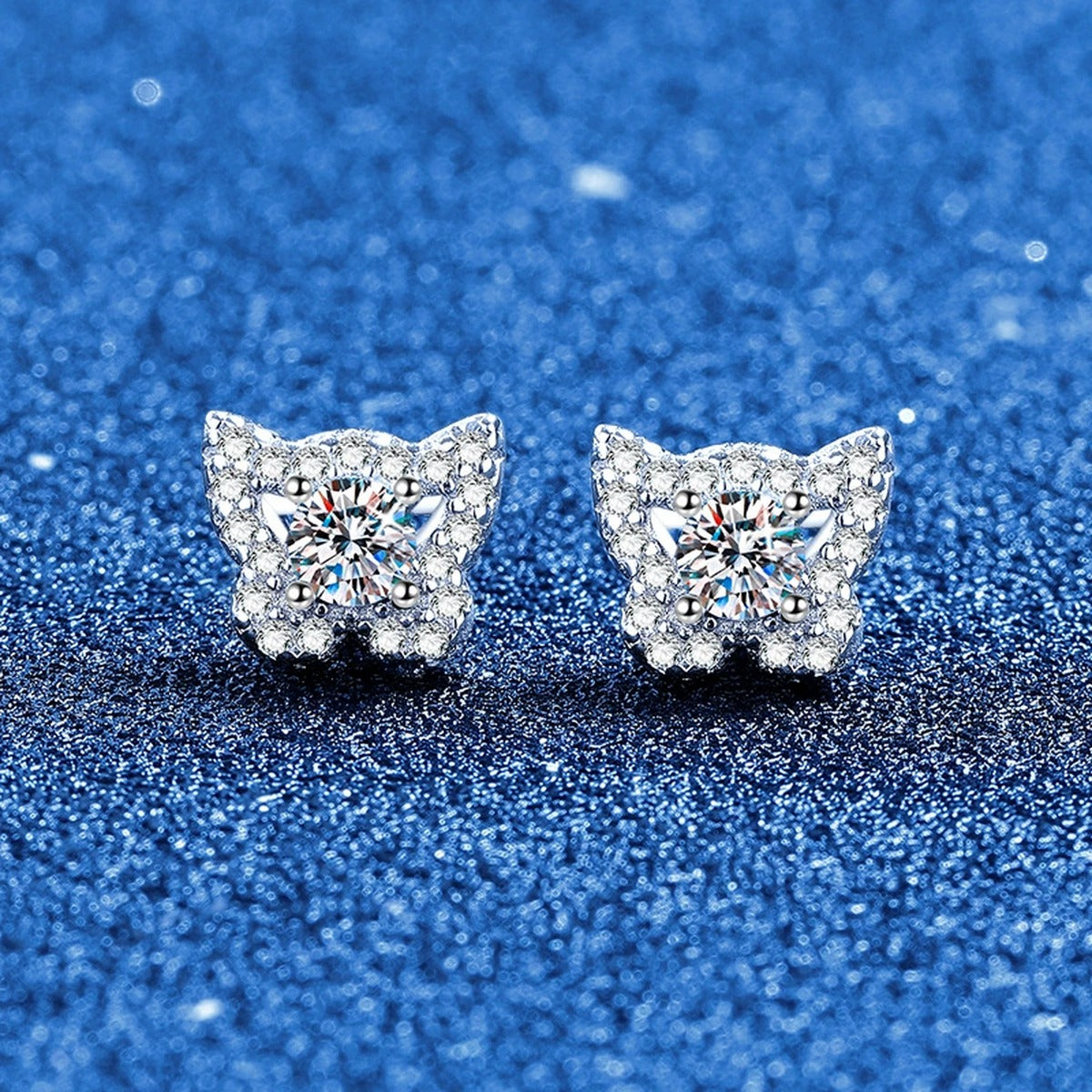 Butterfly Halo Moissanite Stud Earrings in White Gold-Plated S925 Sterling Silver with CZ blue scene angled view