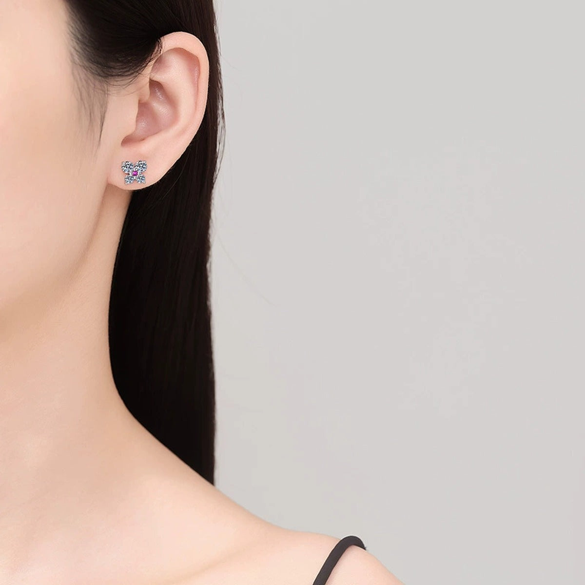 Butterfly Moissanite Stud Earrings with CZ in White Gold-Plated S925 Sterling Silver worn on ear by model