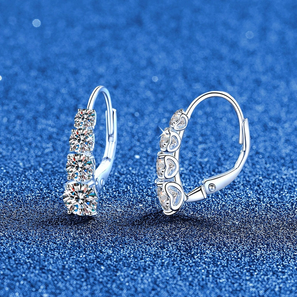 Graduated Moissanite Hoop Earrings in White Gold-Plated S925 Sterling Silver blue scene angled view