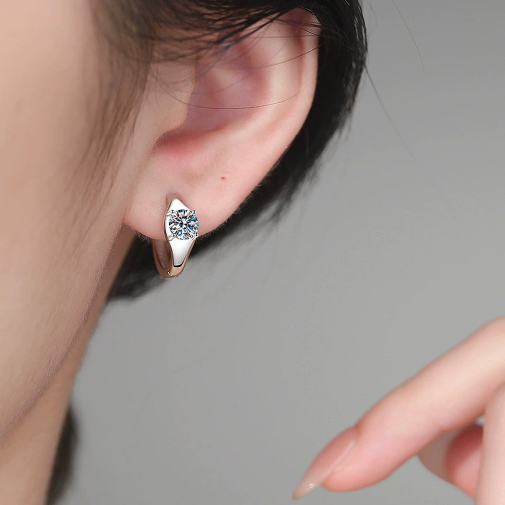 Round Moissanite Huggie Hoop Earrings in White Gold-Plated S925 Sterling Silver worn on ear by model
