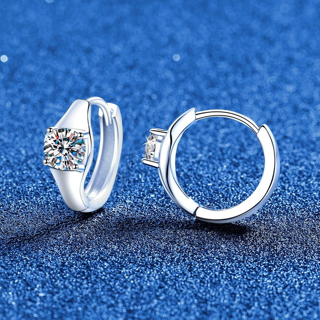 Round Moissanite Huggie Hoop Earrings in White Gold-Plated S925 Sterling Silver blue scene angled view